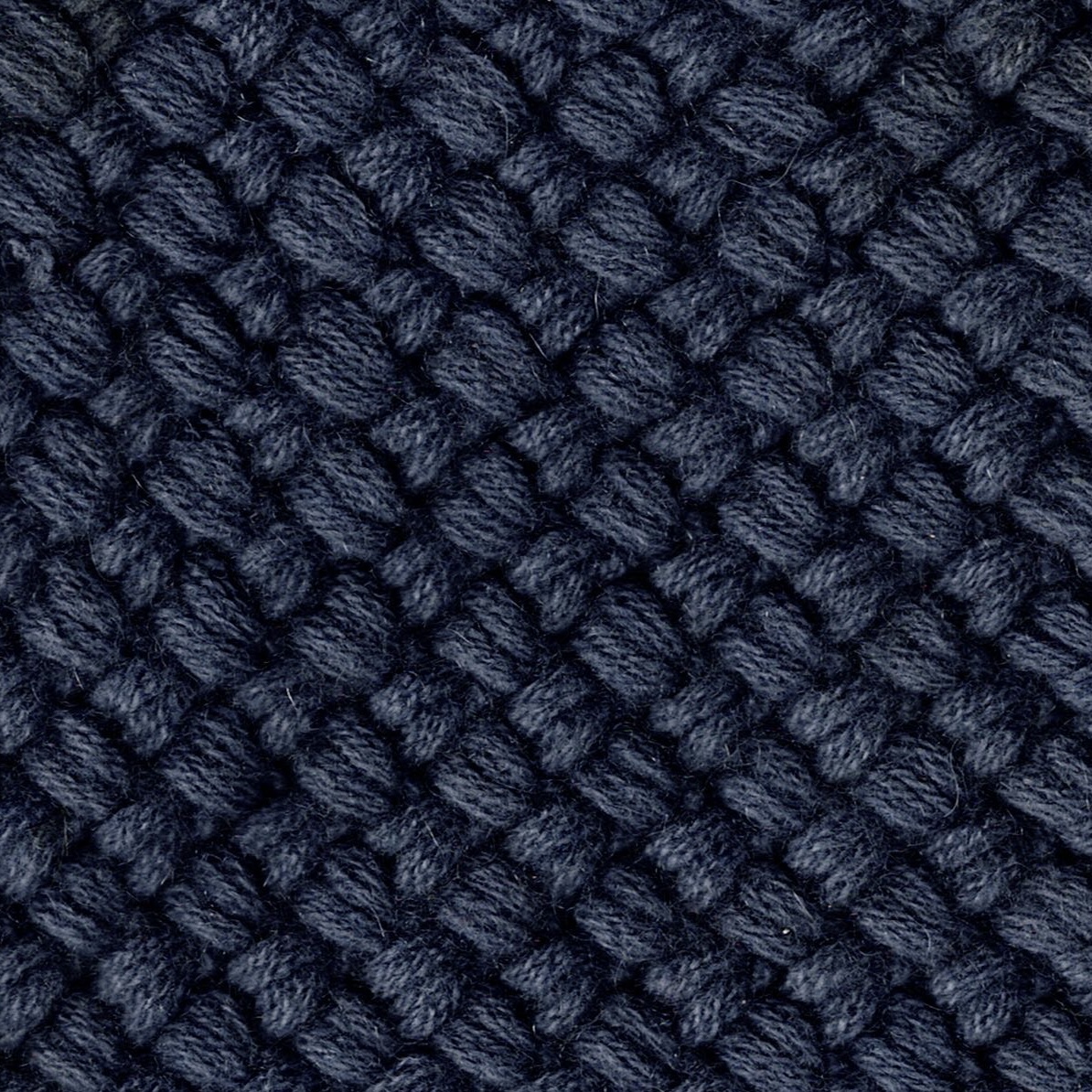 A dark navy cashmere knit swatch in a tight basketweave pattern, showcasing a dense, structured texture ideal for outerwear or accessories.